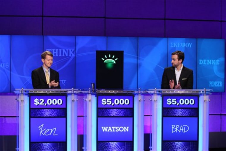 Contestants Ken Jennings, left, and Brad Rutter face off with a computer named Watson on the game show "Jeopardy!" in Yorktown Heights, N.Y. Watson was the winner.